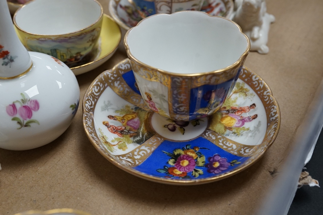 A group of 19th/20th century German porcelain, comprising a Nymphenburg pug, seven Dresden miniature cups and saucers and a Meissen bottle, largest 13cm high